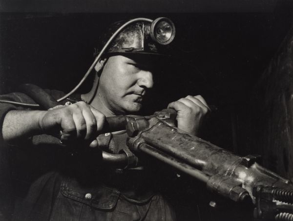 A Smelter Workers Union member, wearing a headlamp.