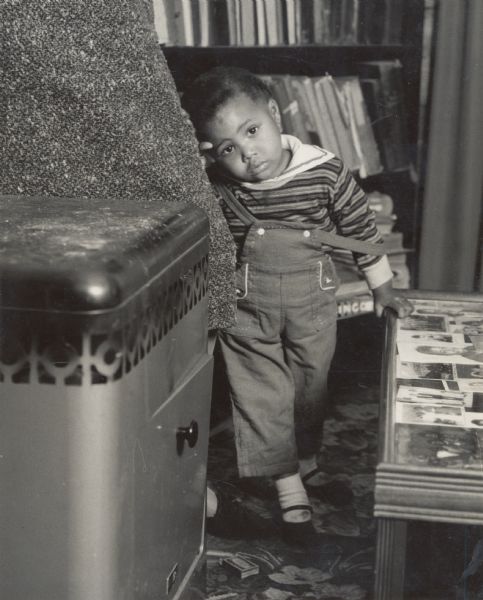 A small African American child wearing overalls on Johns Island.