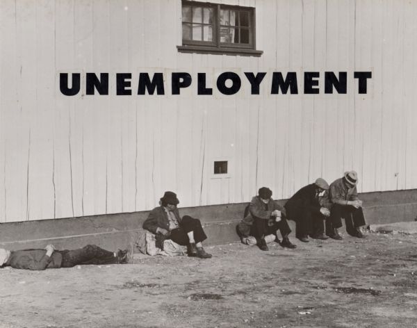 Unemployed men on a street with the word "Unemployment" collaged above.  Part of a series of Highlander collages from the film center.