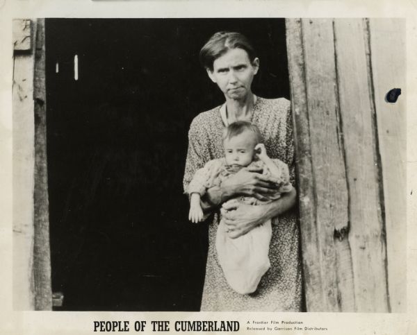 Film still of a frail woman holding a baby, who were neighbors of Highlander Folk School. Promotional material accompanying the film, "People of Cumberland," a Frontier Film Production.