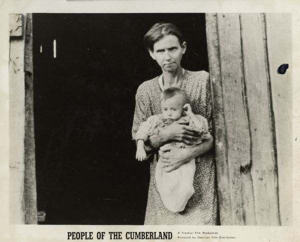 Film still of a frail woman holding a baby, who were neighbors of Highlander Folk School.  Promotional material accompanying the film, "People of Cumberland," a Frontier Film Production.