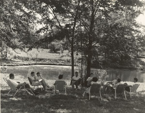 Farmers Union workshop outdoors near water at Highlander Folk School.  B.R. Brazeal is on the extreme left. May Justus, Highlander's Secretary-Treasurer, also pictured.