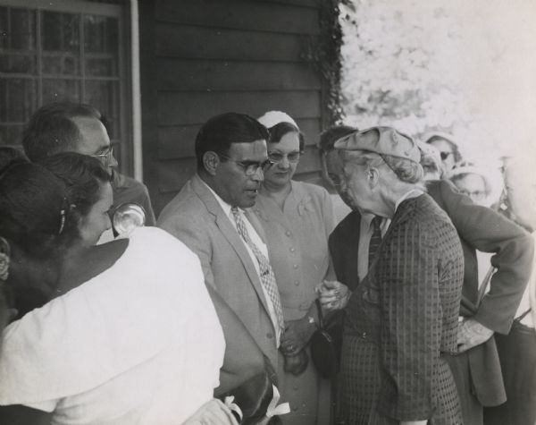 Mrs. Roosevelt at the 25th anniversary of Highlander Folk School, talking with an Indian chief from Florida.