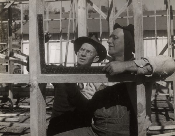 Two men working on the construction of a building at Highlander Folk School.