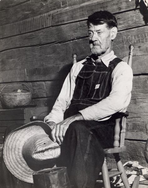 Portrait of Tom Bradley of Greeneville, Tennessee, sitting in a wooden chair.