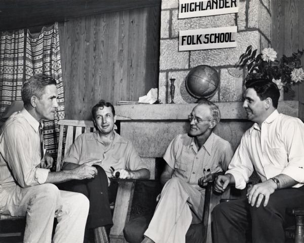 A small group meeting at Highlander.  From left to right: J.C. McAmis, TVA; Myles Horton, Tennessee Farmers Union; Mr. H.N. Hatley, Tennessee Farmers Union; Lee Fryer, Secretary-Treasurer for the National Farmers Union.