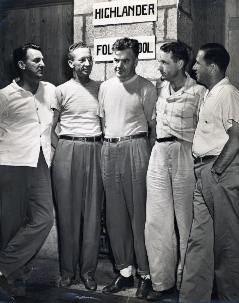 Automobile workers standing with Myles Horton (second from right), at Highlander Folk School.