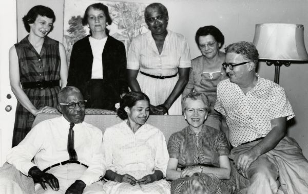 Rosa Parks (center) sitting with a group of friends.  Anne Braden is standing upper left and Carl Braden is seated lower right.