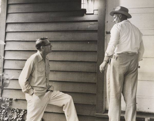 Myles Horton watching as the local sheriff puts a padlock on Highlander Folk School, following a trial in which Highlander was accused of propagating Communism.