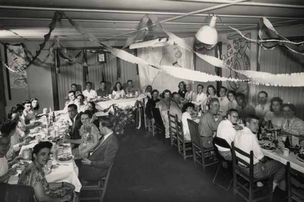 Members of the CIO School at a banquet. Fifth from left, Bill Kornhauser, Antioch student, later professor of sociology. Zilphia Horton, extreme left foreground.