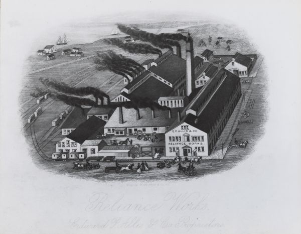 Elevated view of factory with lake and ships in the background. Trains, people, horses, and carriages, with a multitude of smokestacks in foreground. The factory is made of several mostly connected buildings.