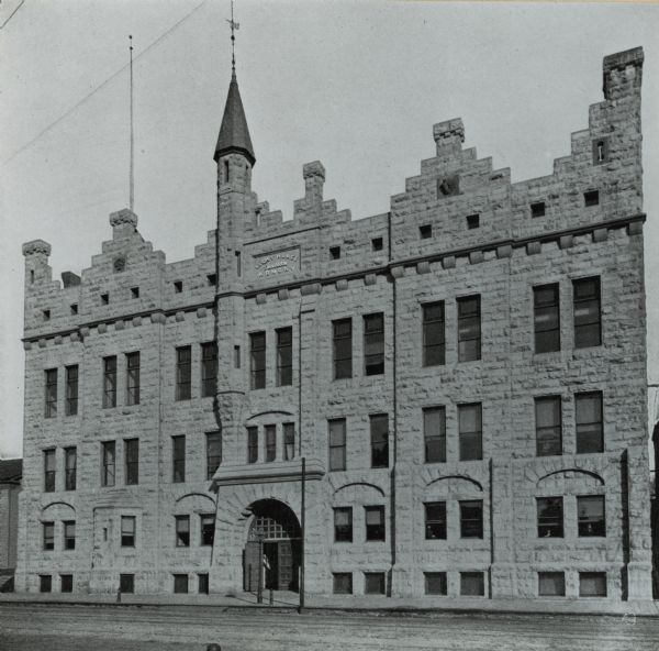 Front of armory on Broadway Street, which has a single turret and a sign that reads "Light Horse Squadron Armory." Housed the Light Squadron of the Wisconsin National Guard.