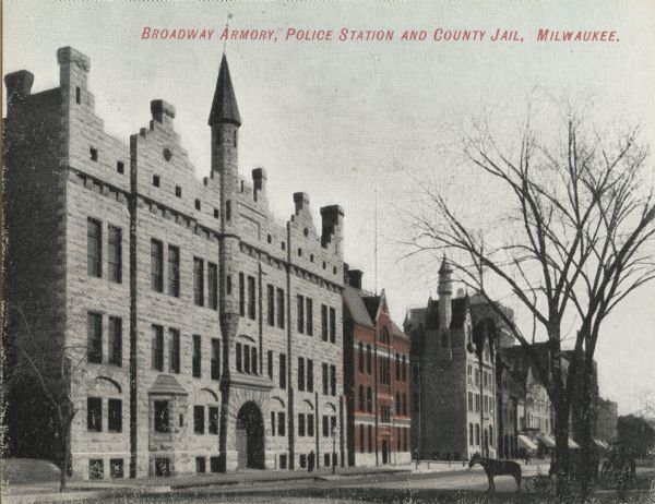 View also includes two trees and a horse-drawn carriage. Caption reads: "Broadway Armory, Police Station and County Jail, Milwaukee."