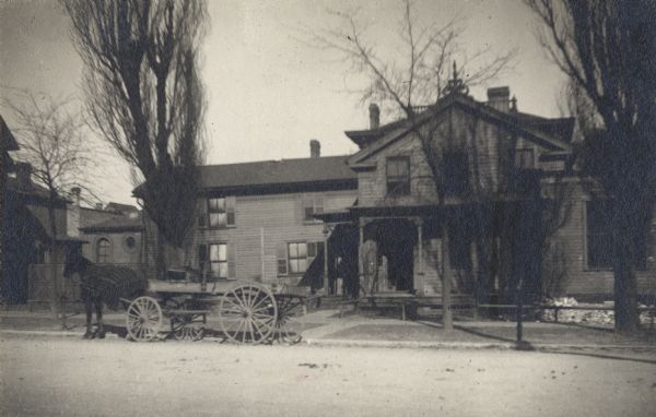 House with several trees, and a horse and cart on the road in front.  Located on Pierce Street near the Falk Brewery. It is Unknown whether or not "Pioneer Summer Resort" is an actual name.