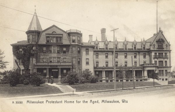 Four-story extended building. A woman with an umbrella is near the left entrance, and a man is walking across the raised lawn near the center right. Caption reads: "Milwaukee Protestant Home for the Aged, Milwaukee, Wis."