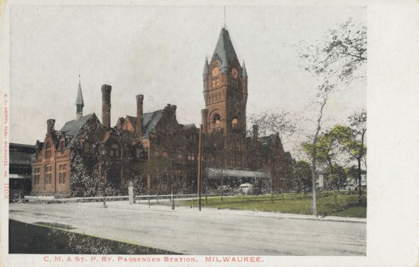 View of the Chicago, Milwaukee, & St. Paul Railway passenger station at W. Everett Street between N. 3rd and N. 4th Streets. View is from the across the street at an angle to the building. Caption reads: "C. M. & St. P. Ry. Passenger Station, Milwaukee."