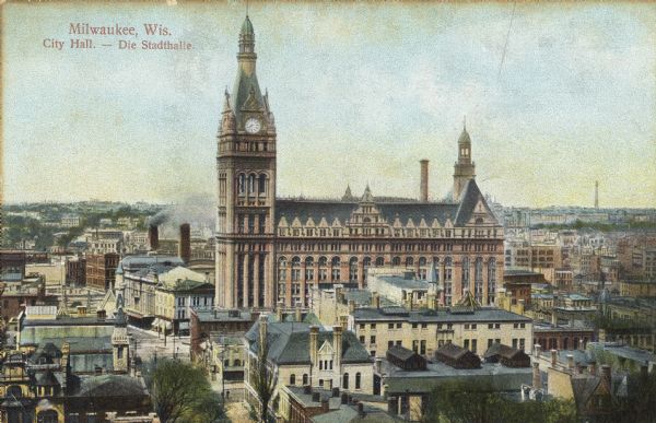 Elevated view across rooftops toward City Hall. Caption reads: "Milwaukee, Wis. City Hall — Die Stadthalle."