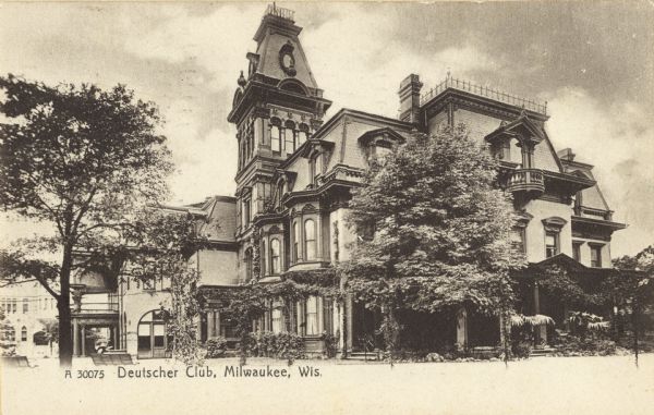 Club building exterior. Club has three levels, with a five story tower. Originally a home turned into a club, the building has many windows, a few balconies, and a great deal of Victorian-era architectural details. Caption reads: "Deutscher Club, Milwaukee, Wis."