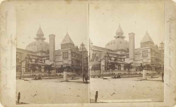 Stereograph; image of building before it was destroyed by fire in 1905. View from across the street. Two small groups of children sit on both sides of the curb.