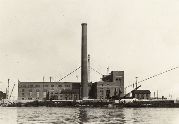 The smokestack is several inches out of plumb, which was the reason the photographer took the photograph. Located on a waterfront.