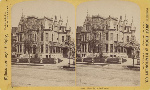 Stereograph of Broadway in Milwaukee. Home has many peaks on the roof, and the drive to the entrance is on the right.