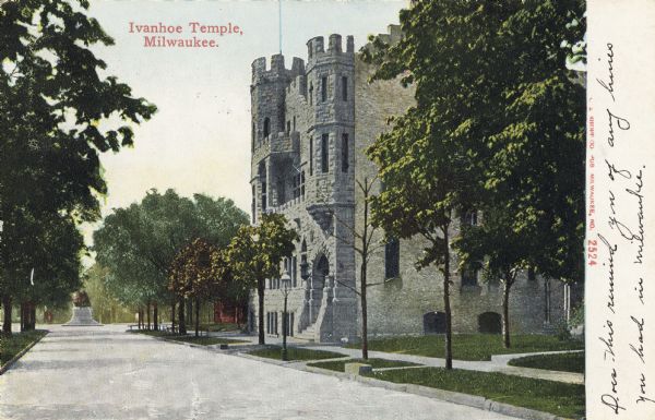 View down street toward the Temple on the right. There is a monument in the background at the end of the road. Caption reads: "Ivanhoe Temple, Milwaukee."