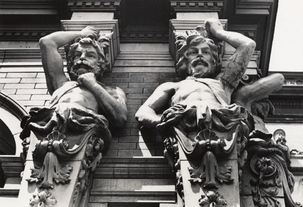 2432 West Kilbourn Avenue. Exterior detail of terra cotta figures of bearded men on the front porch columns.