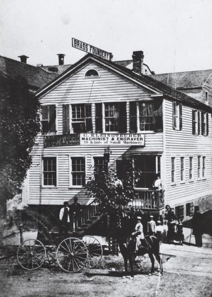 It was in this shop that Christopher Sholes, inventor of the typewriter, did much of his work on various inventions.  This photograph may be as early as the 1860's.  The building is two stories, with the basement partially above ground.