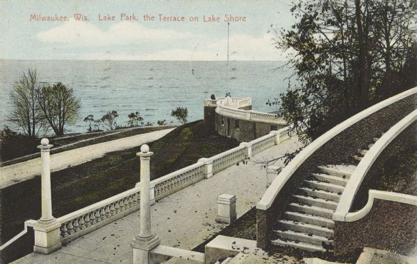 View looking down toward a curving stairway leading down to a terrace with columns and ornate railings. In the background is a flagpole on the overlook to Lake Michigan. Caption reads: "Milwaukee, Wis. Lake Park, the Terrace on Lake Shore."