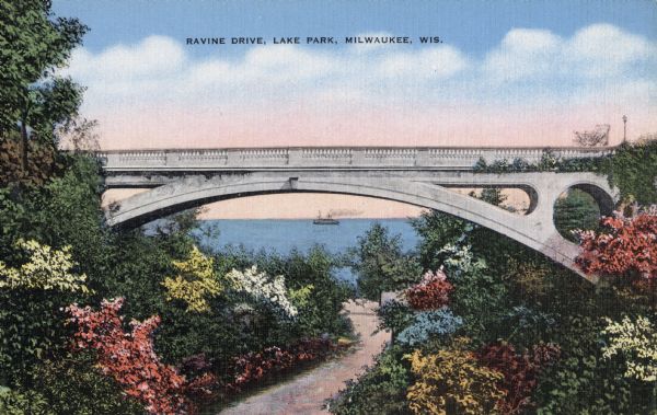 View down curving road lined with flowering bushes toward a bridge in Lake Park. Lake Michigan is in the distance, with a ship at the horizon. Caption reads: "Ravine Drive, Lake Park, Milwaukee, Wis."