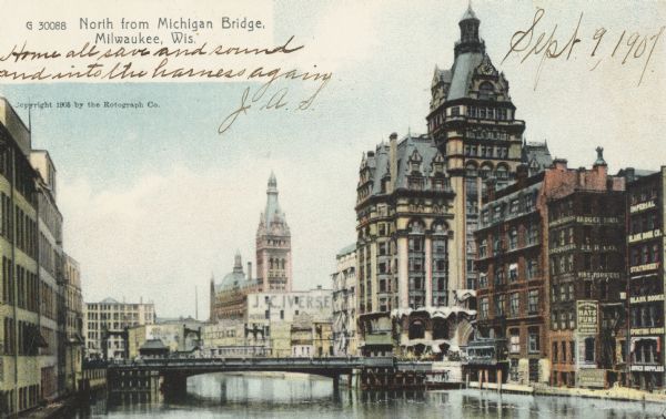 View of the Michigan Bridge across the Milwaukee River, and downtown area. Caption reads: "North from Michigan Bridge, Milwaukee, Wis."