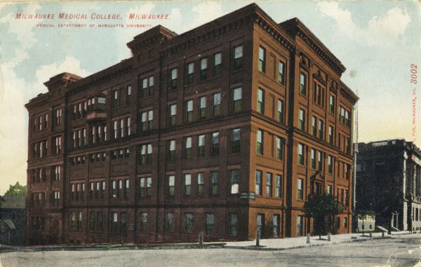 The college occupies a large red building on the corner. A flag pole stands next to the building on the right. Caption reads: "Milwaukee Medical College, Milwaukee. Medical Department of Marquette University."