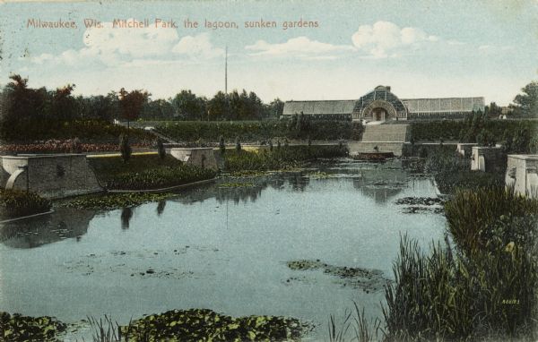 Lagoon in the sunken gardens with the conservatory in the background. Caption reads: "Milwaukee, Wis. Mitchell Park, the lagoon, sunken gardens."