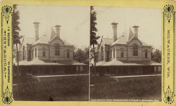 Stereograph. Memorial Hall and Post Office. The hall was dedicated on March 16, 1882.  Capable of seating an audience of 500-600 for performances, the building was designed by the architectural firm of H.C. Koch & Co.  Entrance and right sides are visible behind some bushes.