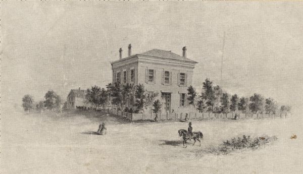 The building has a fence around it and the yard is filled with trees.  Pedestrians are in the road, as well as a man riding a horse.