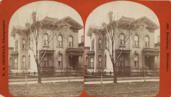 Stereograph. Residence of Giudo Pfister, at 429 Jefferson Street. A tree stands between the sidewalk and the dirt road.