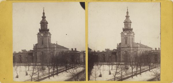 Stereograph. Elevated view over Courthouse Square (now Cathedral Square) and Jackson Street towards the cathedral, which has a large clock tower.