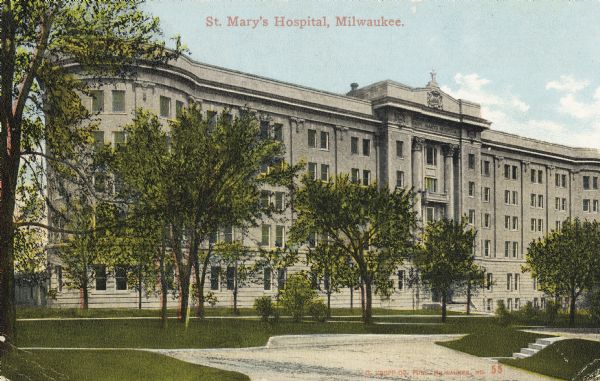 End of wing on left is circular. Trees are in front of hospital in a small park area. Caption reads: "St. Mary's Hospital, Milwaukee."