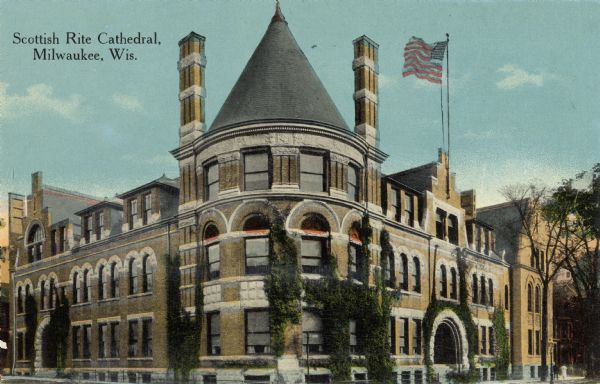 Exterior view of cathedral. A flag is flying from the roof on the right. Caption reads: "Scottish Rite Cathedral, Milwaukee, Wis."