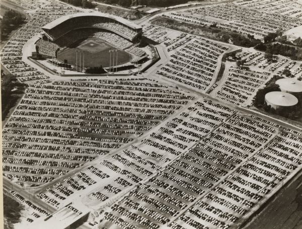 Home baseball park for the Milwaukee Braves baseball team. The field is on the upper left, with the rest of the image taken over by the full parking lots.
