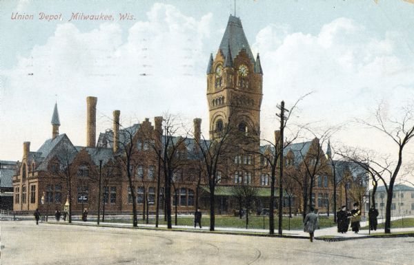 Chicago, Milwaukee & St. Paul Railway Station, located at W. Everett Street between N. 3rd and N. 4th Streets. Clock tower in center. Caption reads: "Union Dept, Milwaukee, Wis."