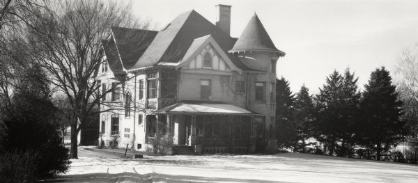 Exterior of Dean's Residence at 10 Babcock Drive. There is a front porch and a turret.