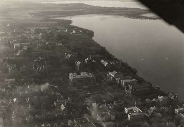 University of Wisconsin-Madison, looking west. Lake Mendota and Picnic Point are in the upper right of the image. Bascom Hall, the Red Gym, the Wisconsin Historical Society, the Memorial Union, and Science Hall are some of the buildings visible.