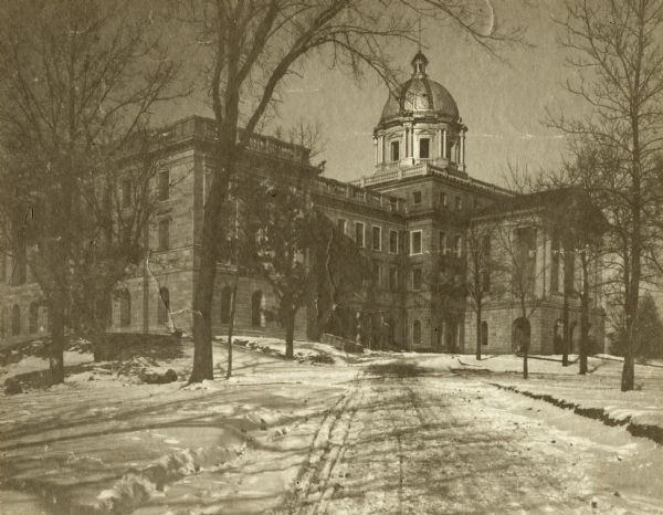 Exterior of south side of Bascom Hall (formerly Main Hall) on the University of Wisconsin-Madison campus with snow on the ground.