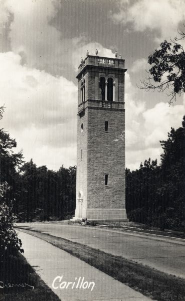 Carillon Tower on the University of Wisconsin-Madison campus. There is a plaque on a rock near the curb close to the entrance to the tower.