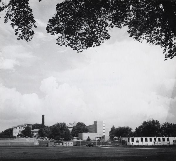 View from distance across field of E.B. Fred Hall, the first home of the bacteriology department, on the University of Wisconsin-Madison campus.
