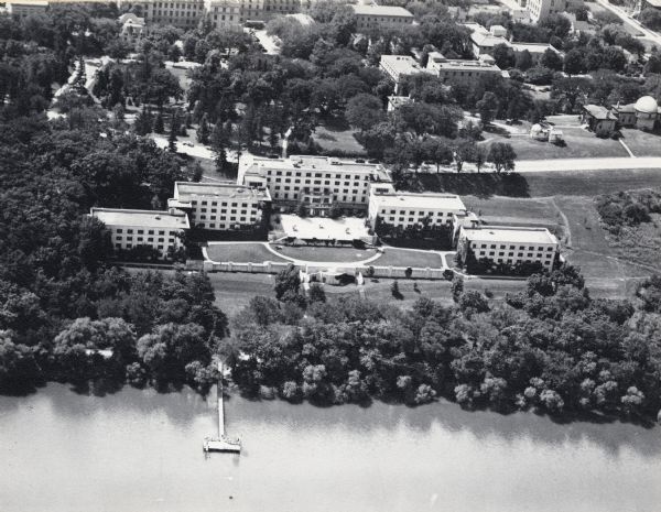 Aerial view of the Elizabeth Waters women's dormitory on the University of Wisconsin-Madison campus. The dorm is also referred to as "Liz" or "The Rock". A long pier extends into Lake Mendota.