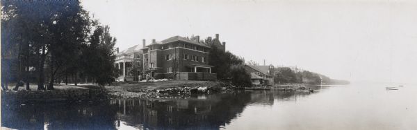 View from Lake Mendota of house at 630 N. Lake Street. Robert C. Spencer, architect. The Armory and University of Wisconsin-Madison Boathouse are behind and to the right along the shoreline.