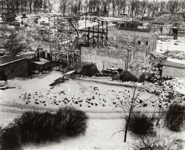 Elevated view of dormitories under construction on the University of Wisconsin-Madison campus. The Lake Mendota shoreline is in the background.