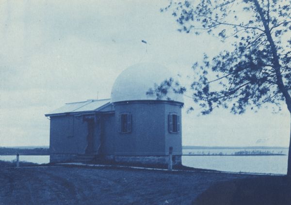 Observatory building on hill on the University of Wisconsin-Madison campus. Lake Mendota and Picnic Point are in the background.